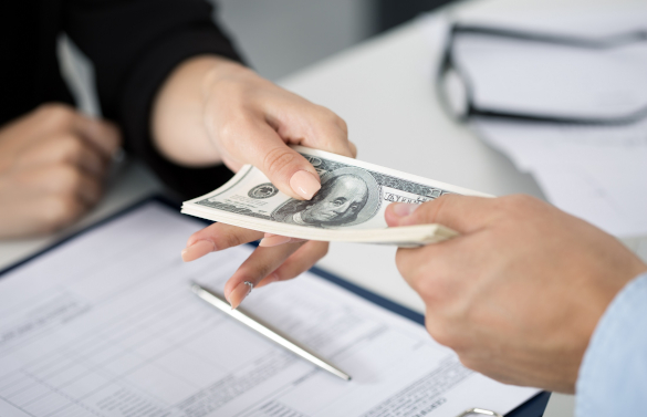 Someone Handing Cash Over